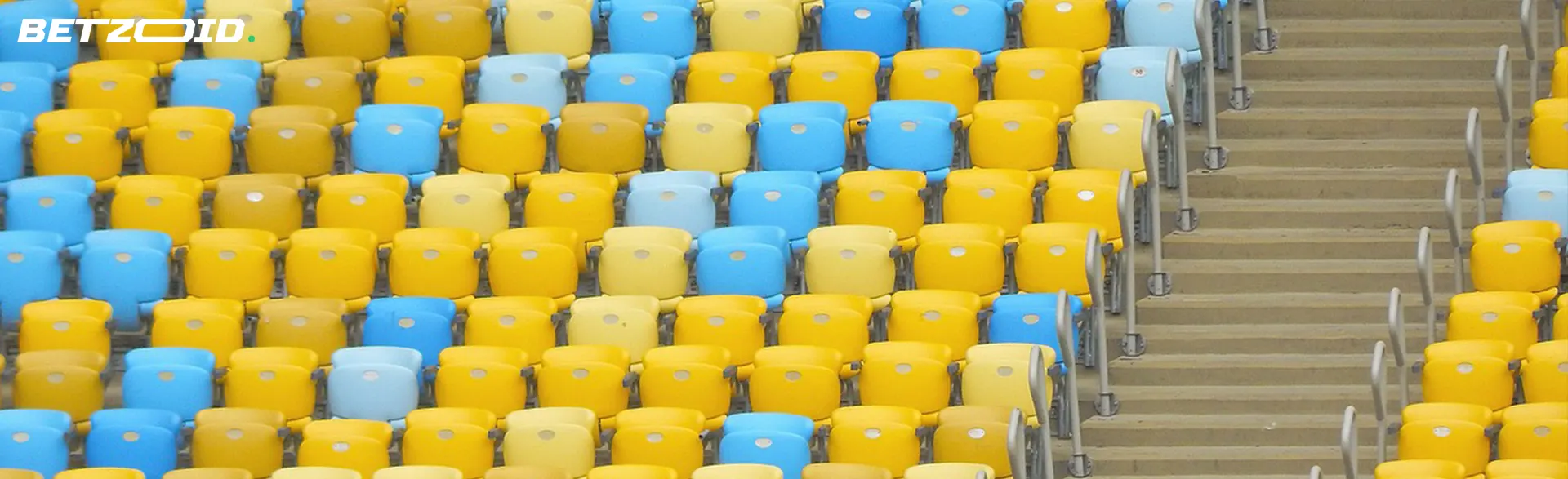Empty sports stadium seats in blue and yellow.